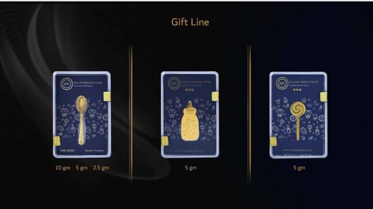 The BTC Gift Line: a gold baby spoon, a gold baby bottle and a gold lollipop, each sealed in a blue Bullion Trading Center card